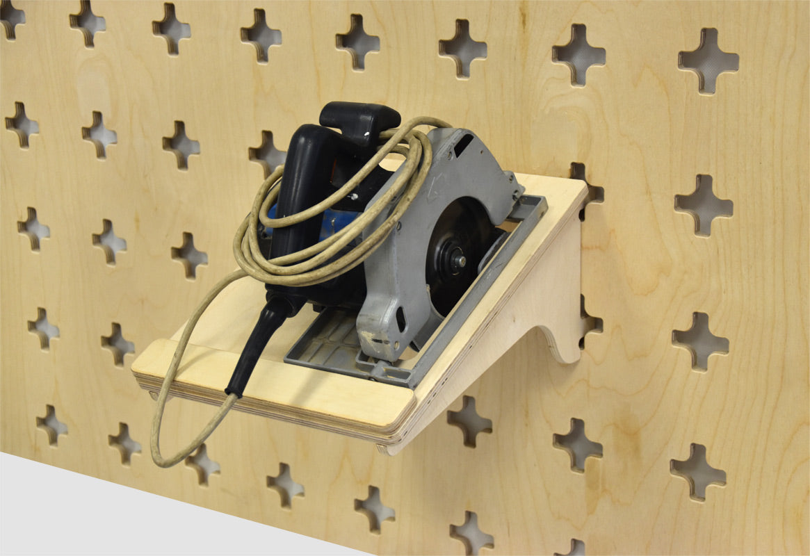 Holder for handheld circular saw